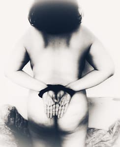 Black and white photo of me with hands tied, seen naked from the rear